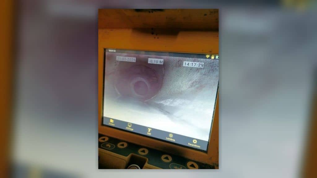 Inspection caméra d'une canalisation en contrepente dans un parking souterrain